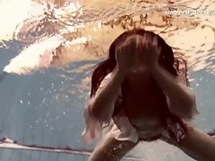 Sexy underwater teen swimming