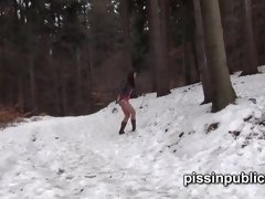 Girls in need skate around in the snow to find a proper place to have a pee
